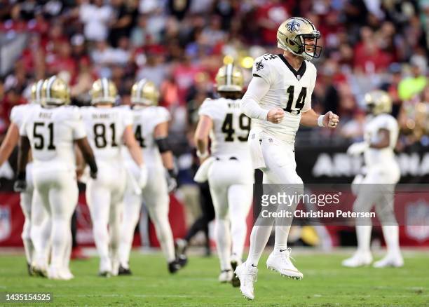 Quarterback Andy Dalton of the New Orleans Saints reacts after a touchdown pass during the 1st quarter of the game against the Arizona Cardinals at...