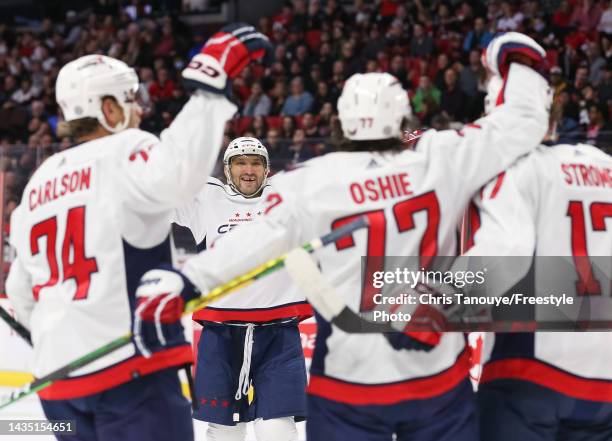 Alex Ovechkin of the Washington Capitals celebrates T.J. Oshie first period goal against the Ottawa Senators with John Carlson and Dylan Strome...