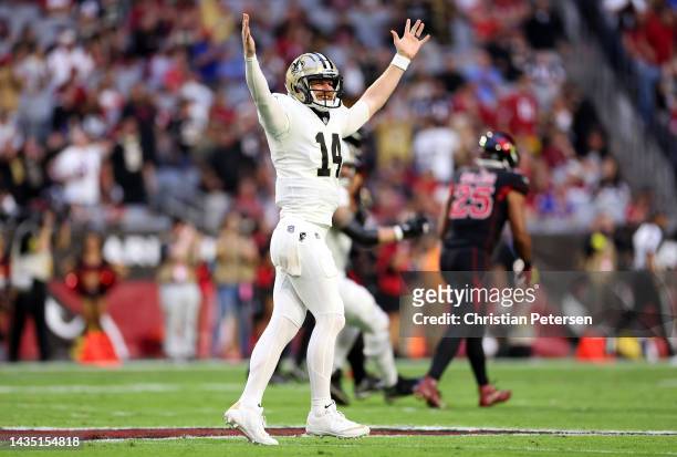 Quarterback Andy Dalton of the New Orleans Saints celebrates after throwing a touchdown pass during the 1st quarter of the game against the Arizona...