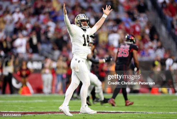 Quarterback Andy Dalton of the New Orleans Saints celebrates after throwing a touchdown pass during the 1st quarter of the game against the Arizona...