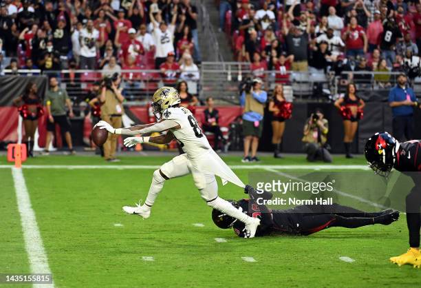 Rashid Shaheed of the New Orleans Saints makes a catch for a touchdown as Marco Wilson of the Arizona Cardinals defends during the 1st quarter of the...