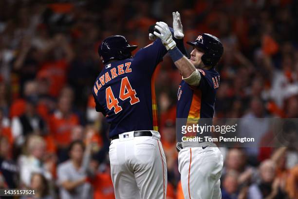 Alex Bregman of the Houston Astros celebrates his three-run home run against the New York Yankees with Yordan Alvarez during the third inning in game...
