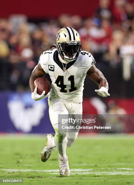Alvin Kamara of the New Orleans Saints carries the ball during the 1st quarter of the game against the Arizona Cardinals at State Farm Stadium on...