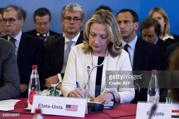 Secretary of State Hillary Clinton attends a meeting at the French foreign ministry in Paris on April 19 as part of international efforts to end the...