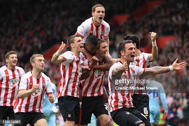 Daniel Fox leads the Southampton celebrations after his sides third goal scored by Jos Hooiveld during the npower Championship match between...