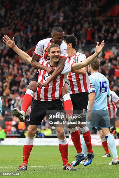 Jos Hooiveld of Southampton celebrates scoring his sides third goal with Guly Do Prado during the npower Championship match between Southampton and...
