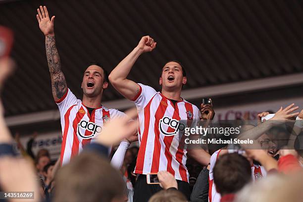 Billy Sharpe and Daniel Fox of Southampton celebrate their sides 4-0 victory and promotion after the npower Championship match between Southampton...