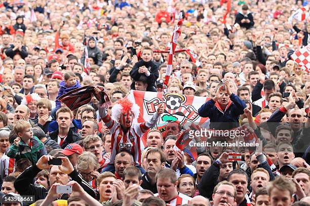 Southampton fans celebrates their team's promotion to the Premier League after the npower Championship match between Southampton and Coventry City at...