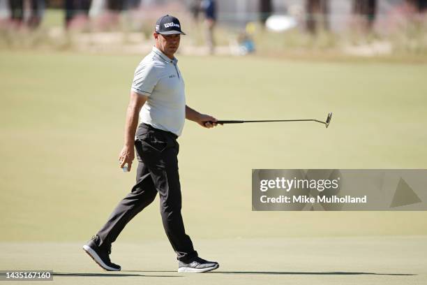 Gary Woodland of the United States walks off the 11th hole after making a birdie during the first round of the CJ Cup at Congaree Golf Club on...