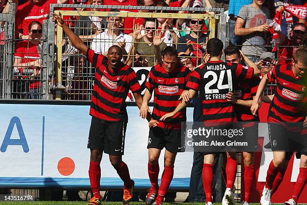 Karim Guede of Freiburg celebrates his team's second goal with team mates during the Bundesliga match between SC Freiburg and 1. FC Koeln at Badenova...