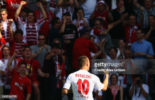 Lukas Podolski of Koeln celebrates his team's first goal during the Bundesliga match between SC Freiburg and 1. FC Koeln at Badenova Stadium on April...