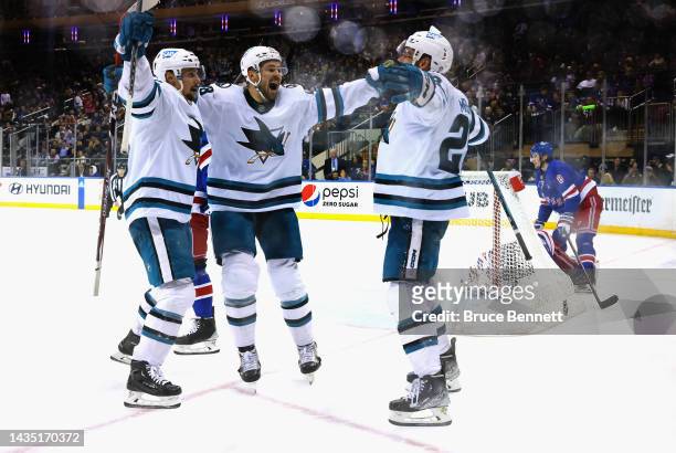 Tomas Hertl, Timo Meier and Erik Karlsson of the San Jose Sharks celebrate Karlsson's overtime goal against the New York Rangers at Madison Square...