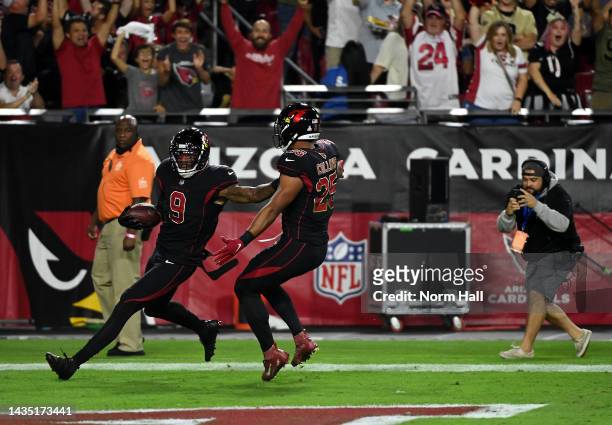 Isaiah Simmons of the Arizona Cardinals celebrates with Zaven Collins after returning an interception for a touchdown during the 2nd quarter of the...