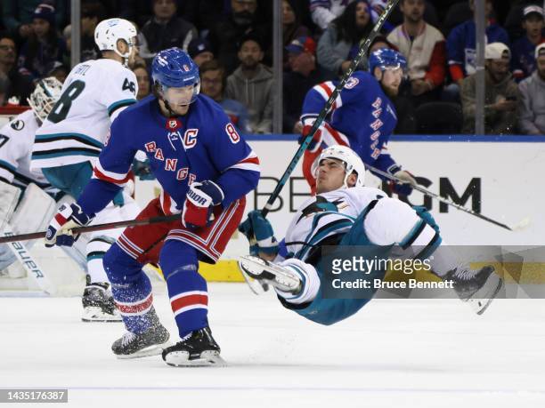 Jacob Trouba of the New York Rangers checks Timo Meier of the San Jose Sharks during the third period at Madison Square Garden on October 20, 2022 in...