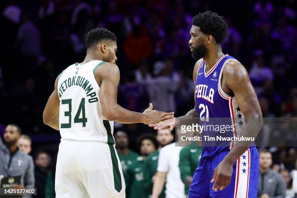 Giannis Antetokounmpo of the Milwaukee Bucks and Joel Embiid of the Philadelphia 76ers embrace after a game at Wells Fargo Center on October 20, 2022...
