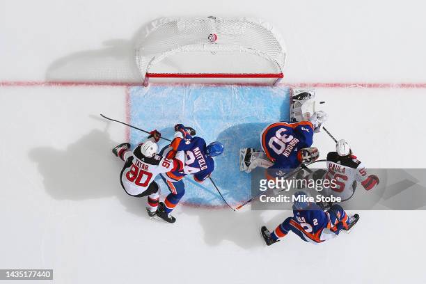 Ilya Sorokin of the New York Islanders makes a save against Erik Haula of the New Jersey Devils in the first quarter of the game at UBS Arena on...