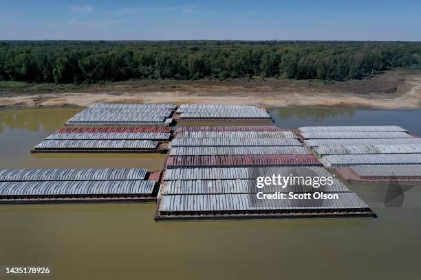 In this aerial view, barges, stranded by low water sit at the Port of Rosedale along the Mississippi River on October 20, 2022 in Rosedale,...