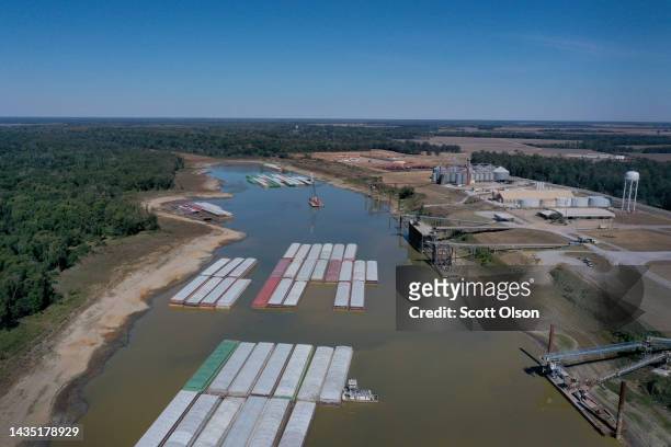 In this aerial view, barges, stranded by low water sit at the Port of Rosedale along the Mississippi River on October 20, 2022 in Rosedale,...