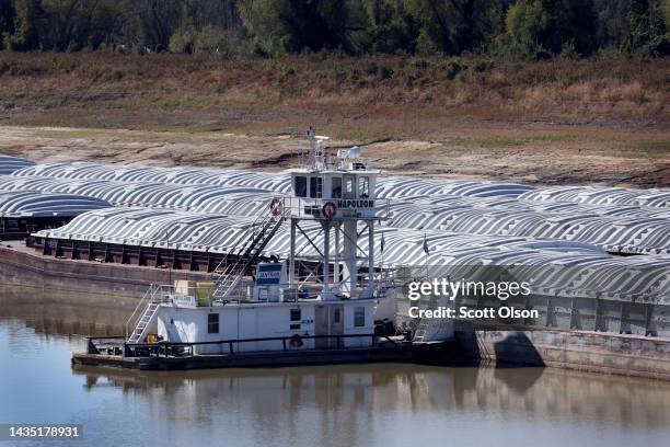 Barges, stranded by low water sit at the Port of Rosedale along the Mississippi River on October 20, 2022 in Rosedale, Mississippi. Lack of rain in...