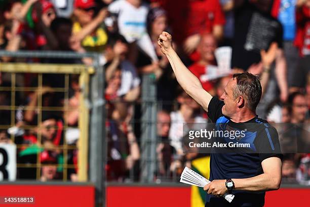 Head coach Christian Streich of Freiburg celebrates with the fans after the Bundesliga match between SC Freiburg and 1. FC Koeln at Badenova Stadium...