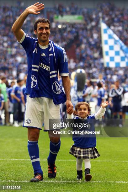 Raul Gonzalez of Schalke and his daughter Maria Gonzalez says farewell to the fans after winning 4-0 the Bundesliga match between FC Schalke 04 and...