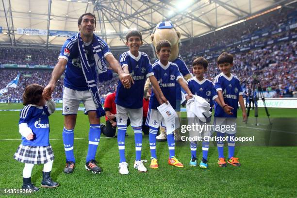 Raul Gonzalez of Schalke and his children say farewell to the fans after winning 4-0 the Bundesliga match between FC Schalke 04 and Hertha BSC Berlin...