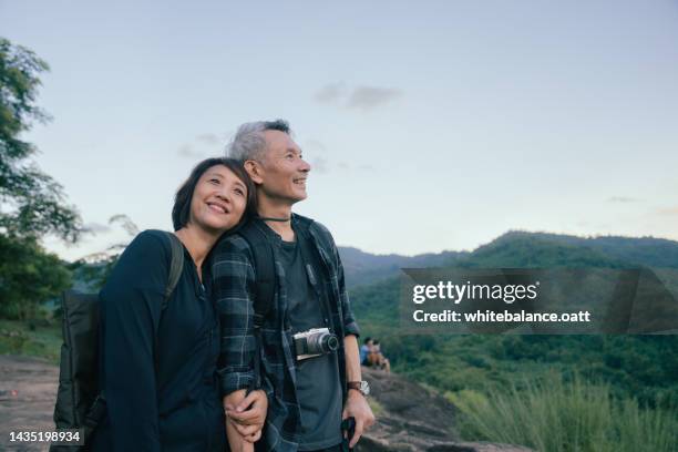 das ist mein leben. - older asian couple stock-fotos und bilder