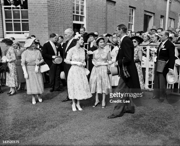 Queen Elizabeth II and Princess Margaret greet trainer Noel Murless in the unsaddling enclosure at Ascot, after the Queen's horse Jardiniere won the...