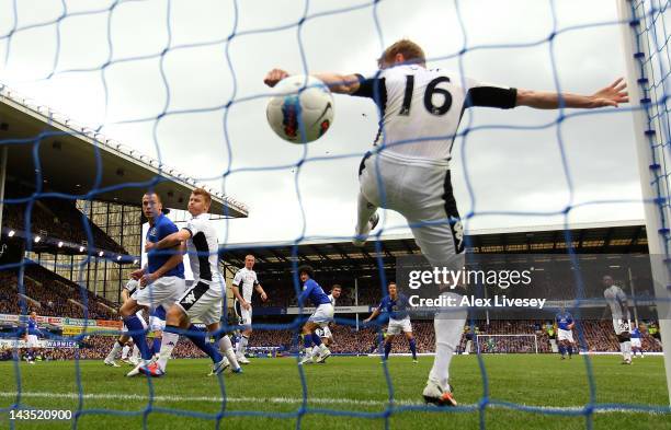 Damien Duff of Fulham is beaten on the line by a header from Marouane Fellaini of Everton for the second goal during the Barclays Premier League...