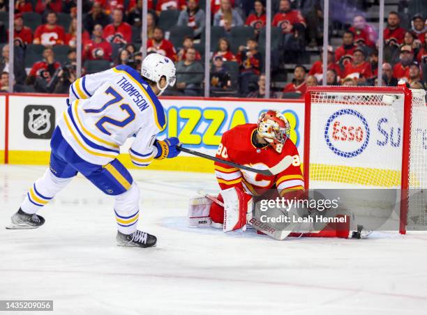 Tage Thompson of the Buffalo Sabres takes a shot on Dan Vladar of the Calgary Flames at the Scotiabank Saddledome on October 20, 2022 in Calgary,...