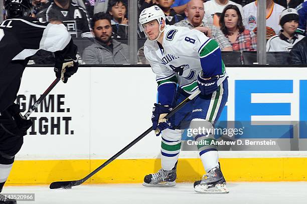Christopher Tanev of the Vancouver Canucks skates with the puck against the Los Angeles Kings in Game Four of the Western Conference Quarterfinals...