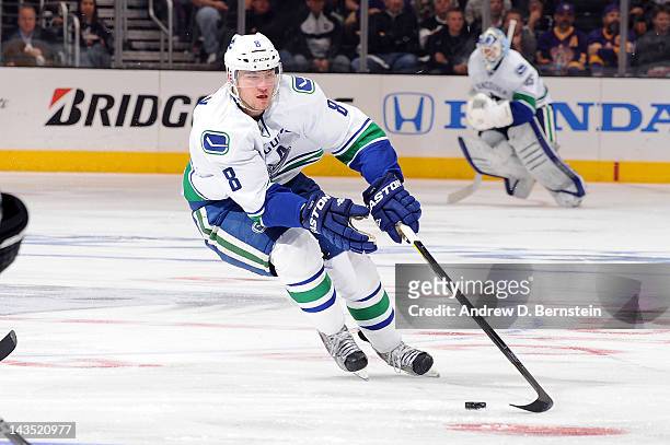 Christopher Tanev of the Vancouver Canucks skates with the puck against the Los Angeles Kings in Game Four of the Western Conference Quarterfinals...