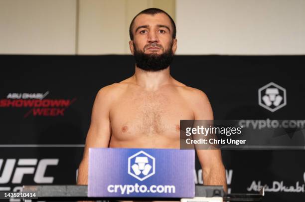 Abubakar Nurmagomedov of Russia poses on the scale during the UFC 280 official weigh-in at Crowne Plaza Yas Island on October 21, 2022 in Abu Dhabi,...