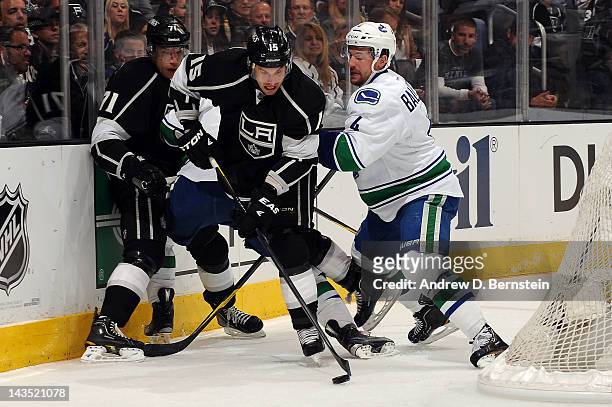 Brad Ricahrdson of the Los Angeles Kings skates with the puck against Keith Ballard of the Vancouver Canucks in Game Four of the Western Conference...
