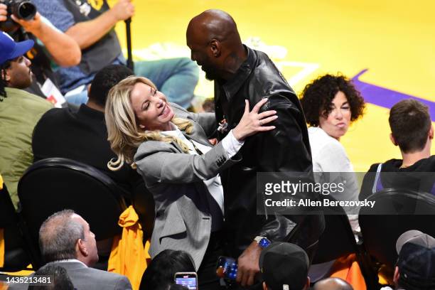 Lakers owner Jeanie Buss reunites with a former Laker Lamar Odom during a basketball game between the Los Angeles Lakers and the Los Angeles Clippers...