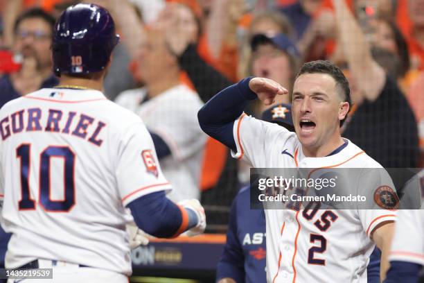 Yuli Gurriel of the Houston Astros celebrates a home run with Alex Bregman during the sixth inning against the New York Yankees in game one of the...