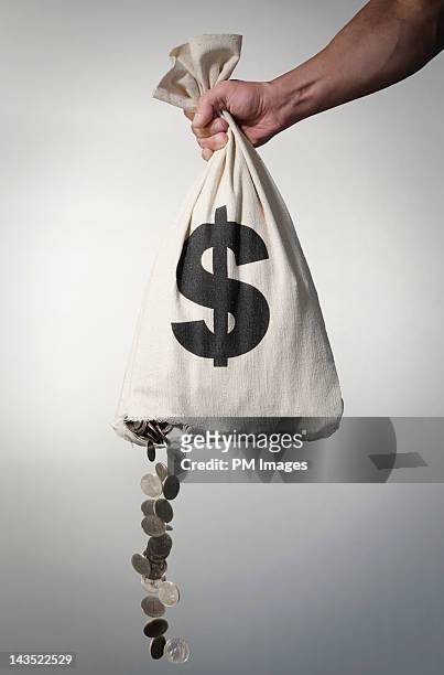 losing money - money bag 個照片及圖片檔