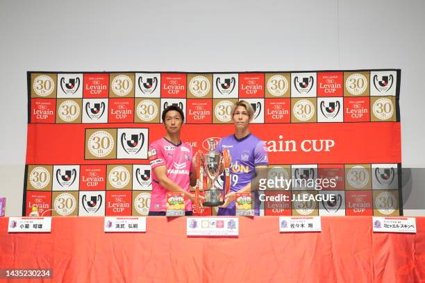Hiroshi KIYOTAKE of Cerezo Osaka and Sho SASAKI of Sanfrecce Hiroshima hold the trophy during the official practice and press conference ahead of...