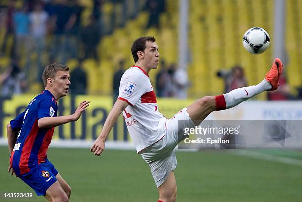Pontus Wernbloom of PFC CSKA Moscow battles for the ball with Artem Dzyuba of FC Spartak Moscow during the Russian Football League Championship match...