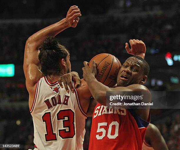 Lavoy Allen of the Philadelphia 76ers battles for the ball with Joakim Noah of the Chicago Bulls in Game One of the Eastern Conference Quarterfinals...