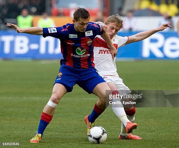 Tomas Necid of PFC CSKA Moscow battles for the ball with Sergei Bryzgalov of FC Spartak Moscow during the Russian Football League Championship match...