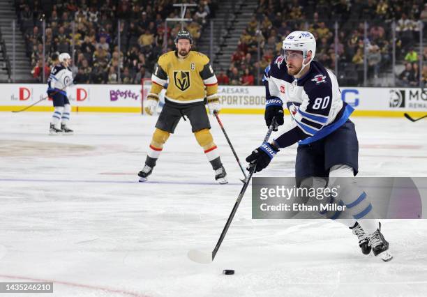 Pierre-Luc Dubois of the Winnipeg Jets skates with the puck against the Vegas Golden Knights in the first period of their game at T-Mobile Arena on...