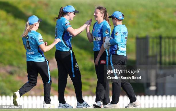 Darcie Brown of the Adelaide Strikers celebrates with team mates Tahlia McGrath, Jemma Barsby and Tegan McPharlin after bowling Maitlan Brown of the...