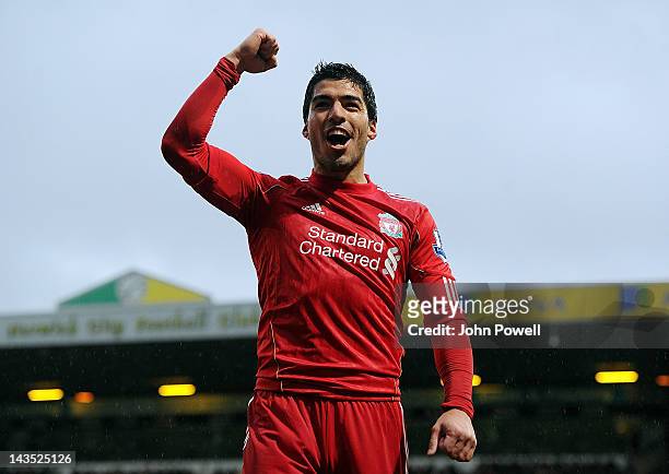 Luis Suarez of Liverpool celebrates after scoring his hat-trick during the Barclays Premier League match between Norwich City and Liverpool at Carrow...