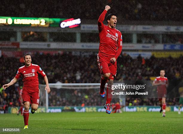 Luis Suarez of Liverpool celebrates after scoring his hat-trick during the Barclays Premier League match between Norwich City and Liverpool at Carrow...