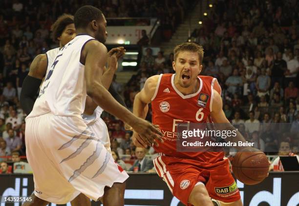 Steffen Hamann of Muenchen fights for the ball with Terrell Everett of Bremerhaven during the Beko Basketball match between FC Bayern Muenchen and on...