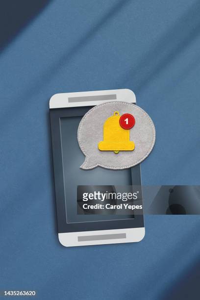 notification message bell yellow color icon on smartphone - notification bell stock pictures, royalty-free photos & images