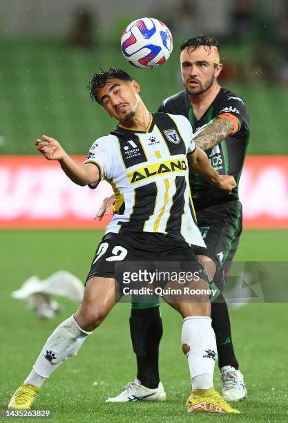 Daniel Arzani of Macarthur FC and Joshua Risdon of Western United compete to head the ball during the round three A-League Men's match between...