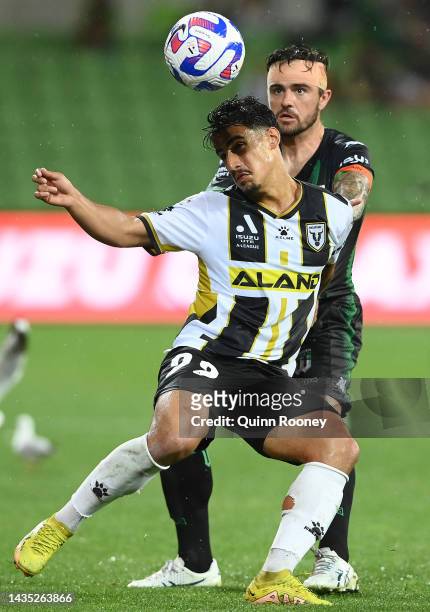 Daniel Arzani of Macarthur FC and Joshua Risdon of Western United compete to head the ball during the round three A-League Men's match between...