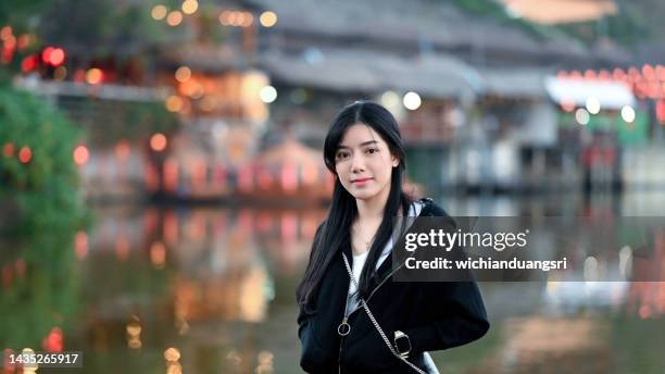 beautiful woman relaxing at sunset pier in mae hong son province, thailand - mae hong son province bildbanksfoton och bilder